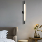 straight black LED wall light on the wall in front of a sofa