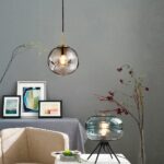 Ball-shaped blown glass suspension worked in a living room
