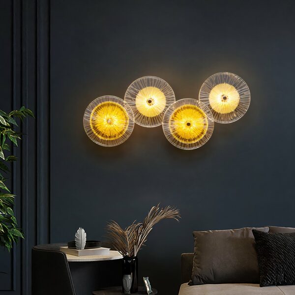 Bohemian LED wall lamp with glass discs, presented lit in a living room