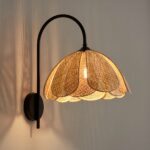 Cane wall light with black metal bracket