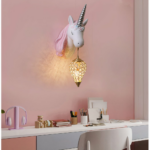Children's resin unicorn wall light on pink background with desk