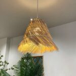 Chinese-style straw hanging lamp in rattan on a grey background