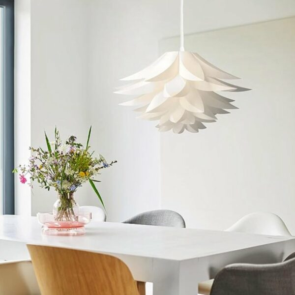 Decorative modern origami pendant above a dining table