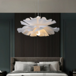 Flower-shaped petal chandelier in acrylic on a grey background in a bedroom