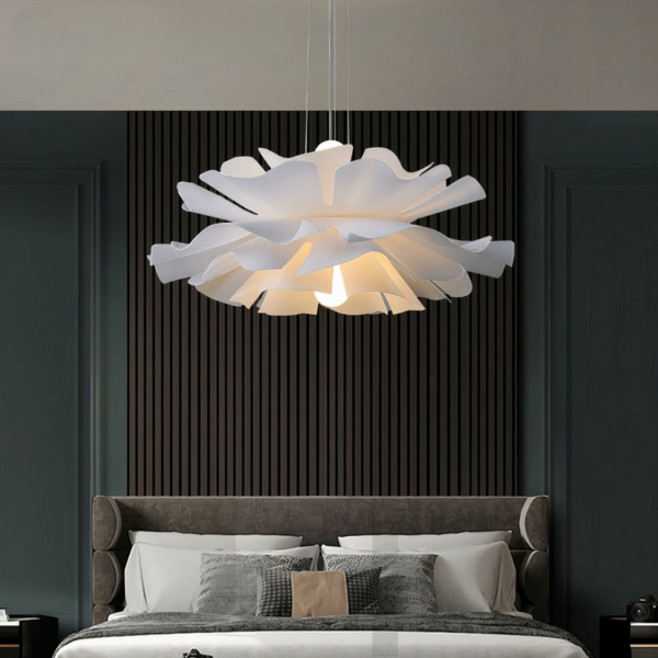 Flower-shaped petal chandelier in acrylic on a grey background in a bedroom
