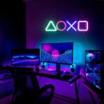 In a gamer's office, a futuristic neon wall light is lit on the wall.