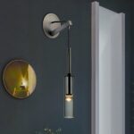 Grey wall light for bedroom, in a room with black walls