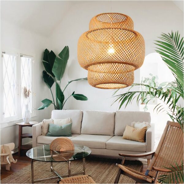 Hand-woven bamboo lantern suspensionHand-woven bamboo lantern suspension on white background with sofa and plantsby hand