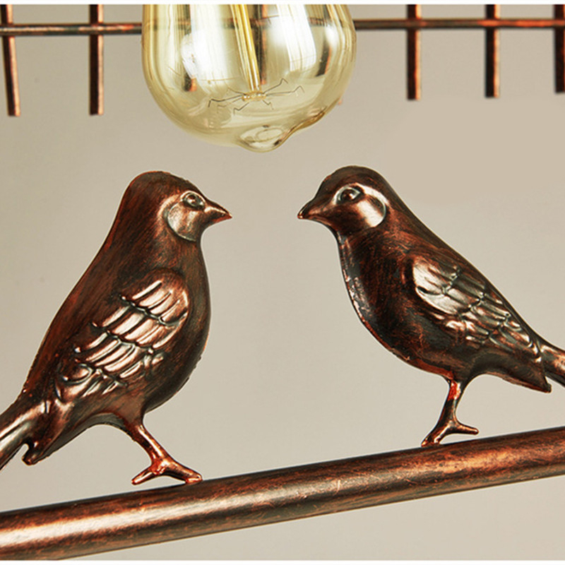 Hanging bird Open birdcage with foliage
