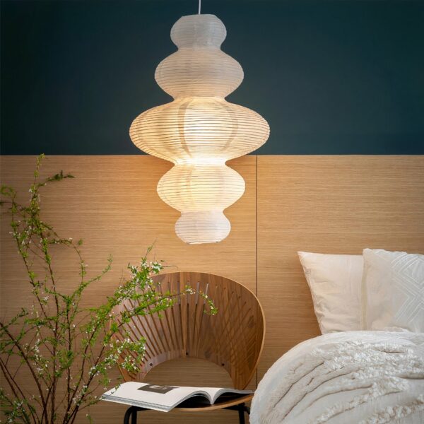Hanging Japanese paper design, in the form of several balls of different sizes glued together, hung in a bedroom