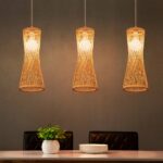 Japanese handmade round bamboo pendant over a dining table