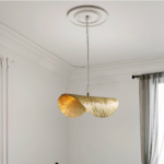 Luxury brass suspension lamp in retro design on a grey background