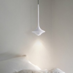 Simple Nordic minimalist design hanging lamp presented near a bed