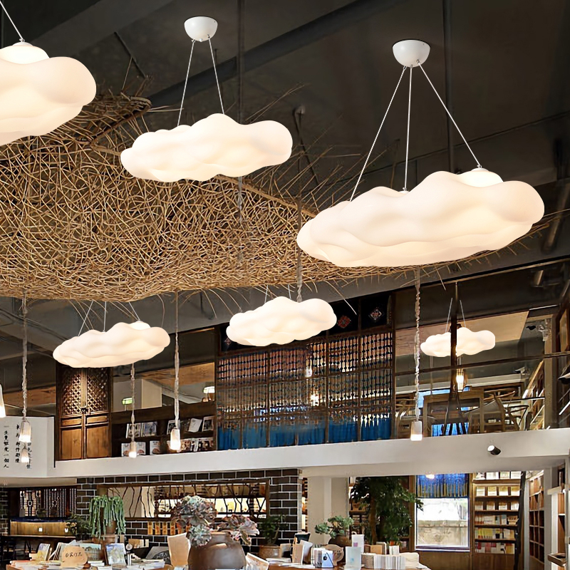 Modern-design acrylic cloud hanging lamp, presented as a hanging lamp several times in a room.