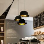 Modern black LED melon-hat pendant in the kitchen