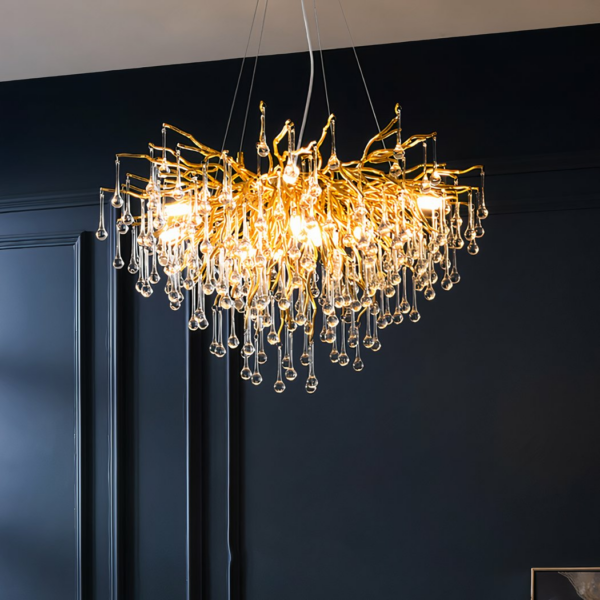 Modern gilded kitchen chandelier in crystal and iron on dark blue background
