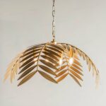 Hanging leaf in glossy finish presented suspended in gold