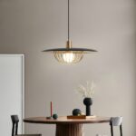 Simple modern retro chic flat pendant above a dining table in a modern setting