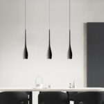 Modern black teardrop pendant presented in a dining room
