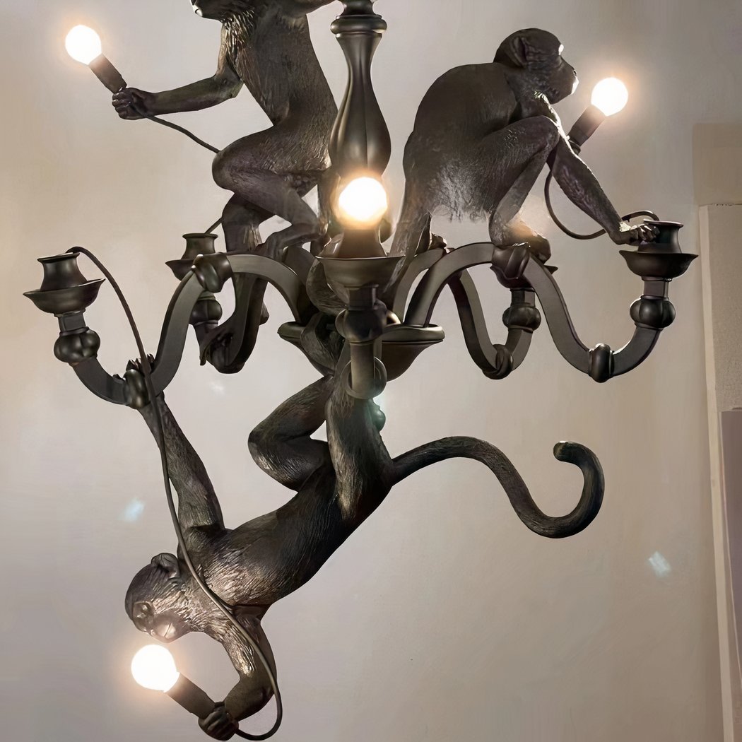 Monkeys hanging 3 animals on the chandelier