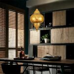 Oriental hanging lamp with rounded retro design in a dining room above a table