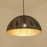 Retro industrial-style metal suspension lamp on beige background
