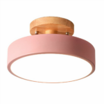 Round metal LED bathroom light on white background
