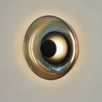 Round transparent wall light with black interior