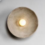 Round wall lamp in organic style