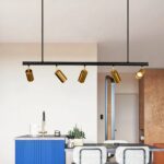 Scandinavian LED chandelier with adjustable gold heads in a vintage blue kitchen