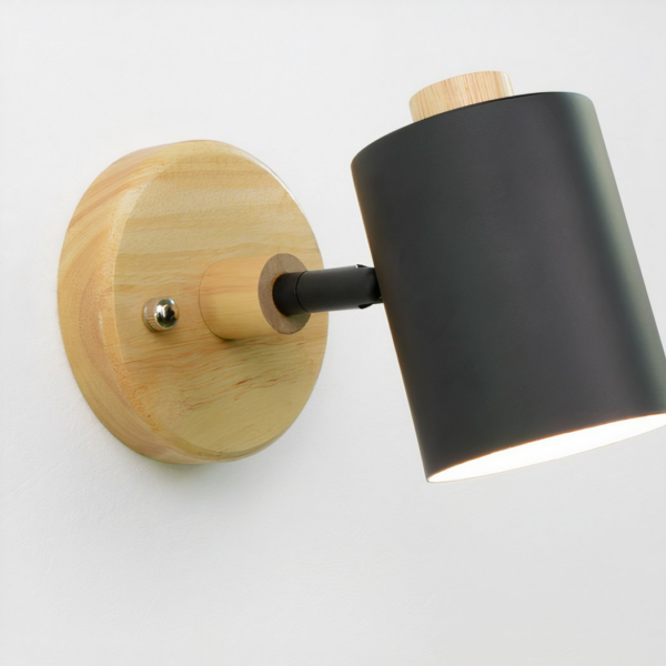 Scandinavian wall light with black swivel head presented on a white background