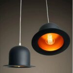 on a dark background we see a suspension with two hats in the modern jazz style