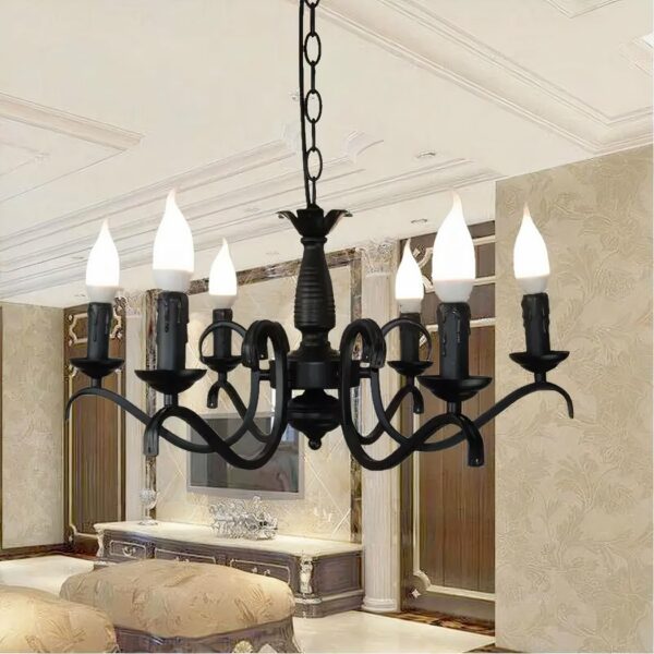 In the living room, a black wrought-iron chandelier hangs from the ceiling.