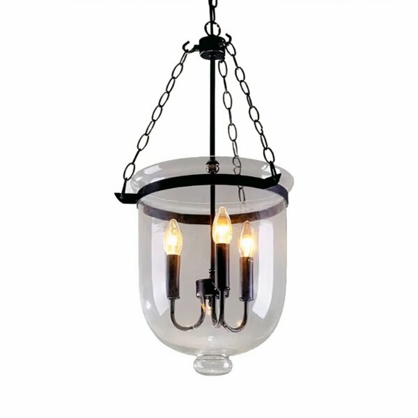 Transparent bucket-shaped chandelier with 3 bulb candles inside. Suspended by 3 black chains, attached to a black metal pin. On a white background.
