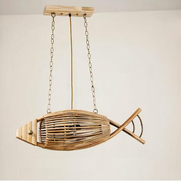Fish-shaped wooden chandelier, suspended by two chains at each end. Connected to a rectangular wooden base. Behind is a beige wall.