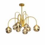 Gilded metal chandelier with 8 arms that gives the impression of fireworks, with 8 gray glass balls and lighted bulbs in each ball. On a white background.