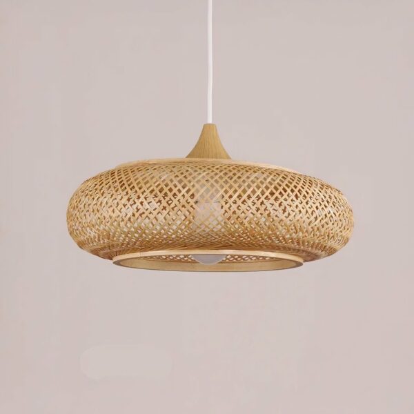 Flat, round hanging chandelier in woven baboo. On a pale pink background.