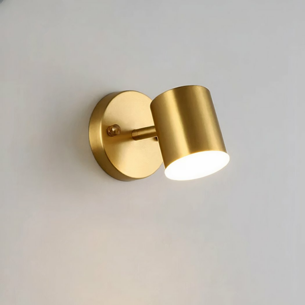 Modern Nordic-style gold LED wall light in aluminium on a grey background