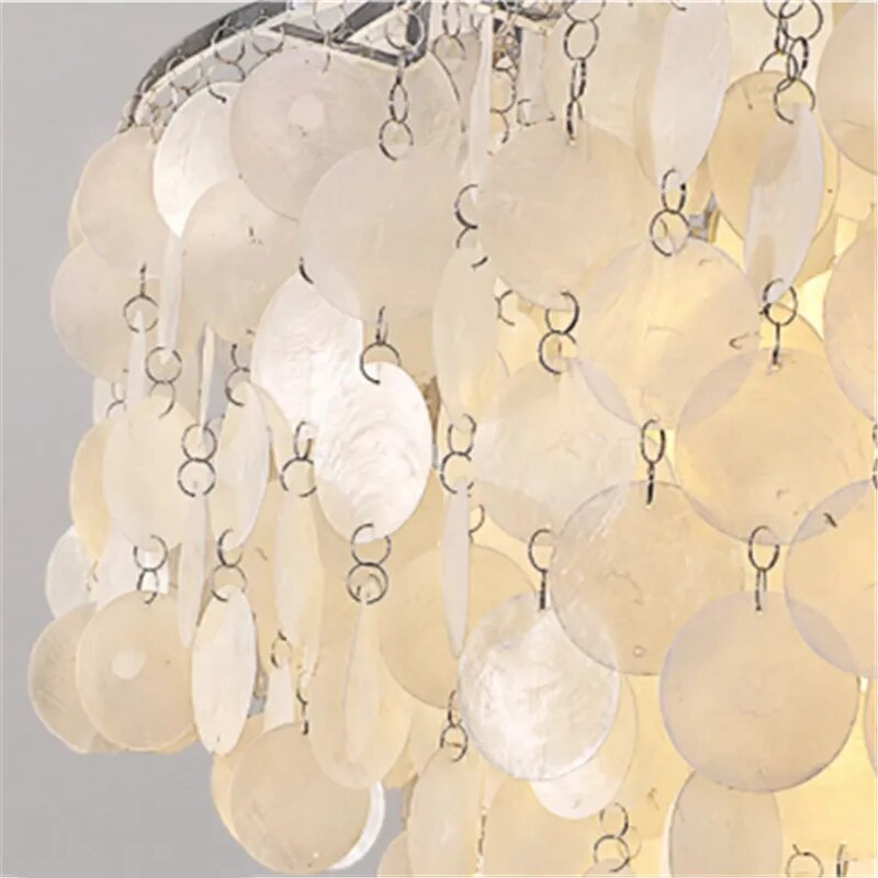 Modern, luxurious mother-of-pearl pendant with round frame