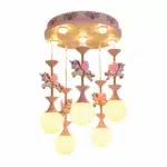 Unicorn carousel chandelier, pink and white. With 5 lit bulbs hanging below the unicorns. On a white background.