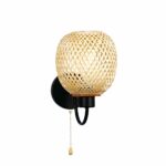 Black and beige wall sconce with black iron base, cord for switching on and off. And a beige, openwork, woven bamboo shade. On a white background.