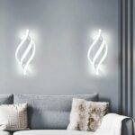 Nordic design LED rotating wall light on grey background with sofa underneath