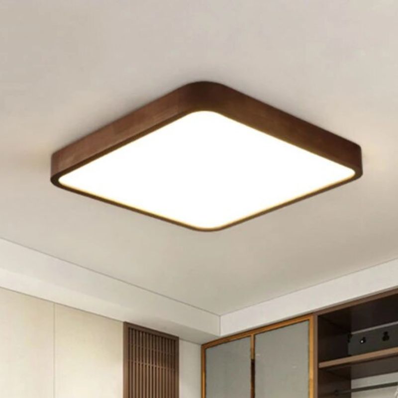 Square wood and acrylic chandelier, glued to the ceiling. A piece of cupboard can be seen in the background.