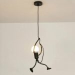 Vintage LED chandelier with rope-climbing character on grey background
