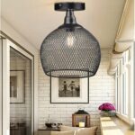 in a light-toned living room, we see a cable-free black suspension in the industrial style