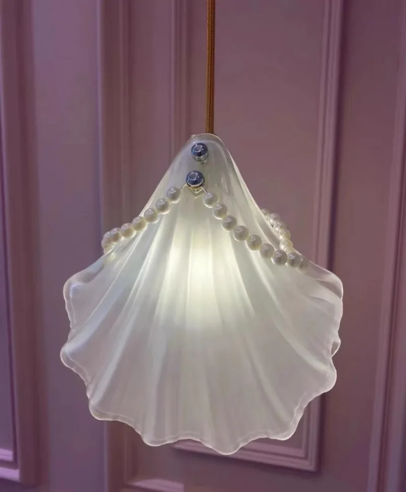 Glass and pearl shell wall light