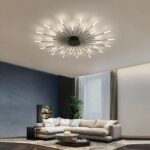 Modern, fireworks-style metal LED ceiling light hanging from the ceiling of a living room, above a sofa.