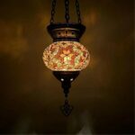 on a dark background we see a brown suspension in the Moroccan style