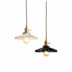 Retro art deco hanging lamp in black or white ceramic, one of each color, suspended on a white background.