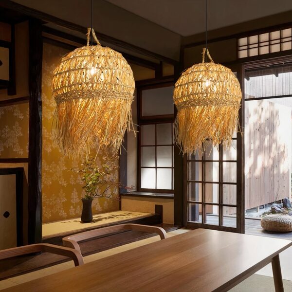 Retro ball chandelier in hand-woven straw and bamboo, lit and suspended over a dining table.